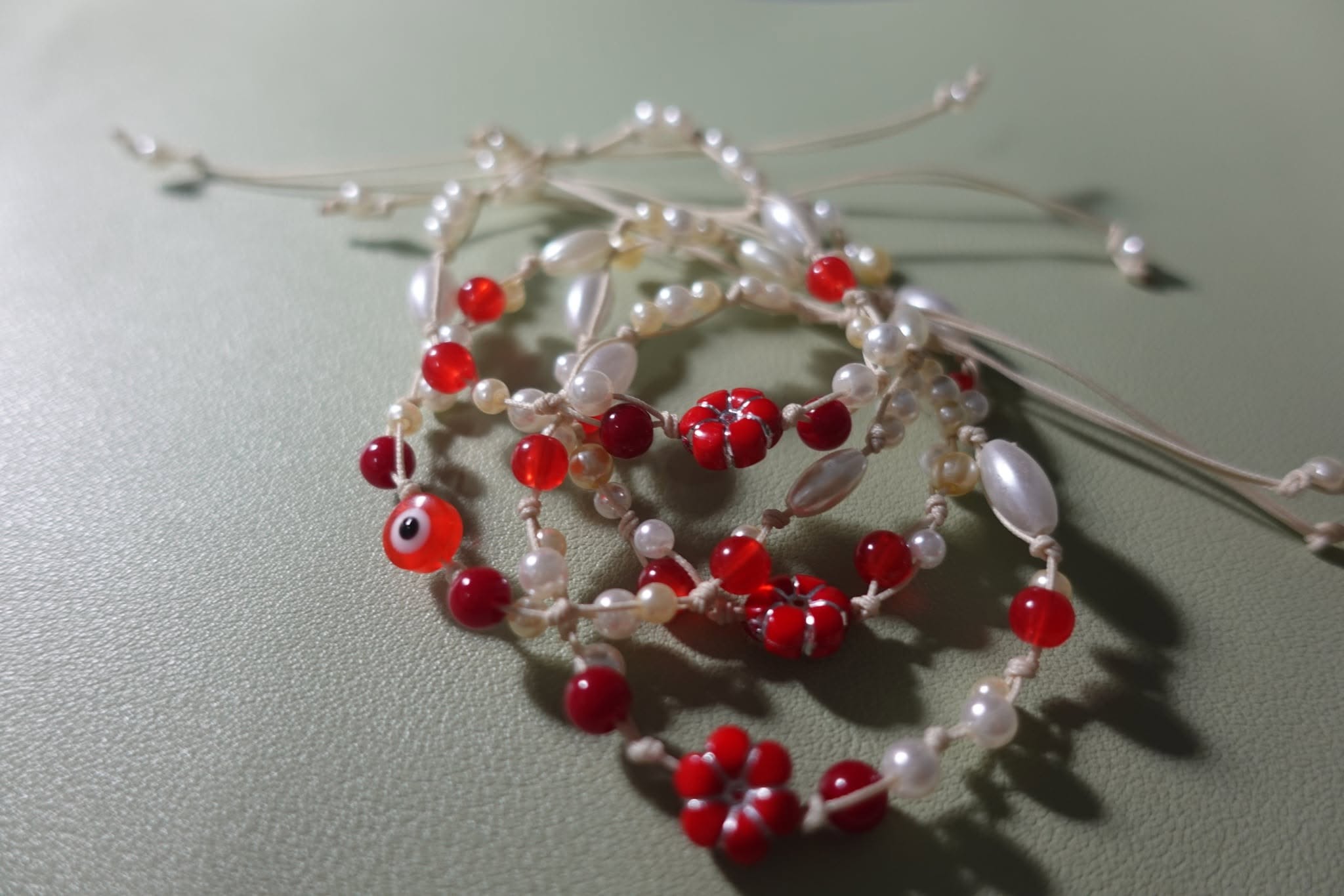 Red and pearl beaded bracelets
